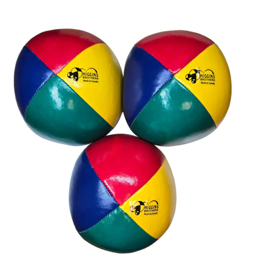 Three colorful juggling balls with a logo on a blank surface