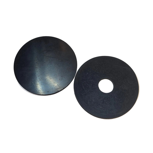 Two black silicone fire prop guards, one solid and one with a center hole, placed on a white background
