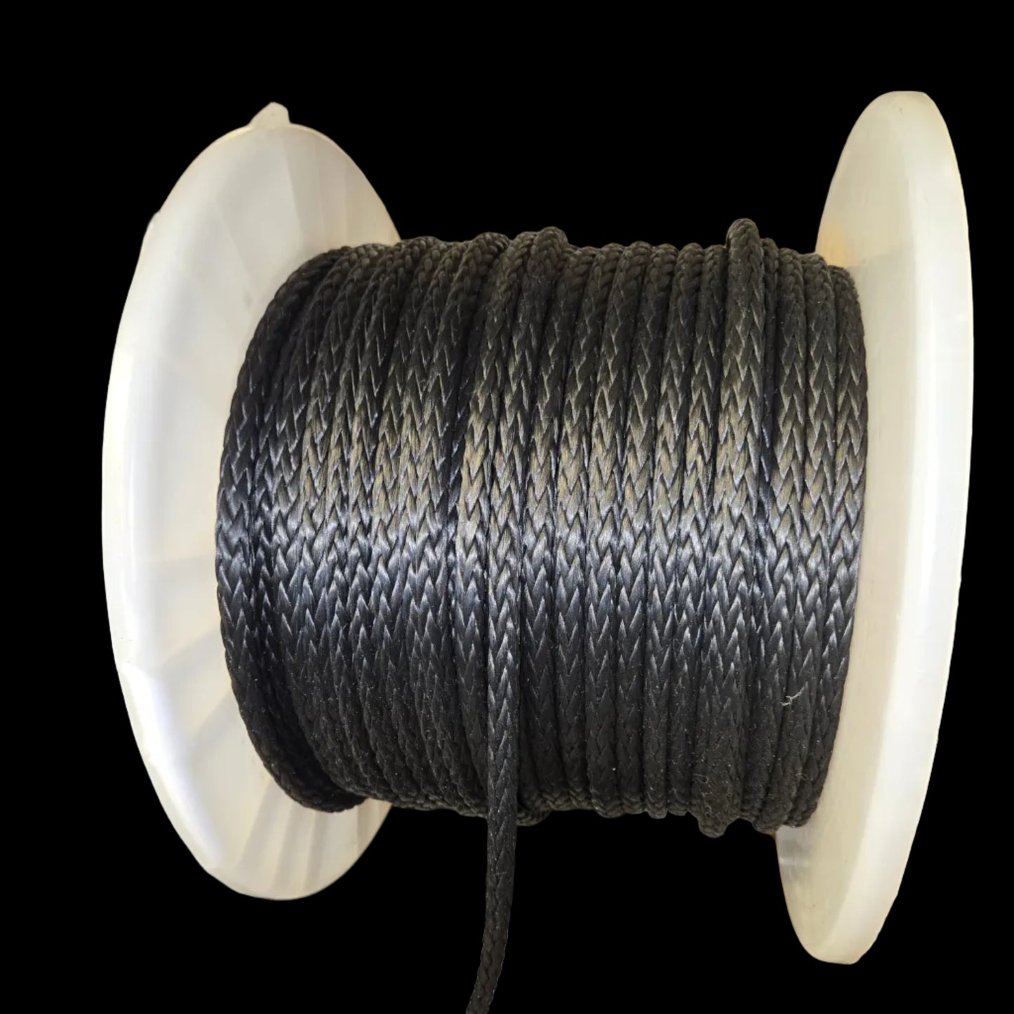 Spool of black Technora rope on a white reel with blurred background