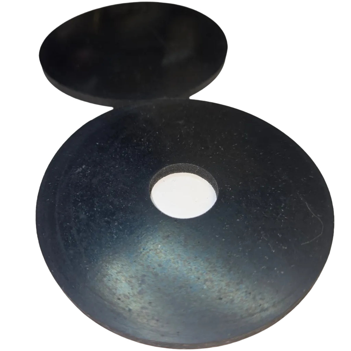 Two round black silicone guards, one with a central hole, photographed on a white surface.